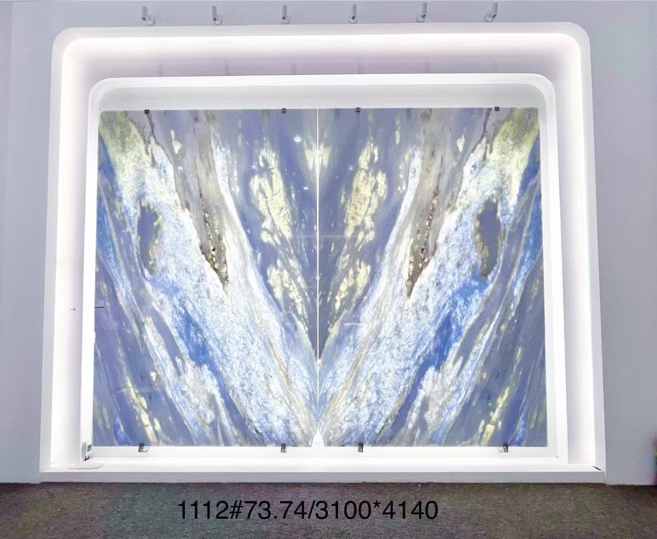 backlit blue quartzite bookmatched slabs wall